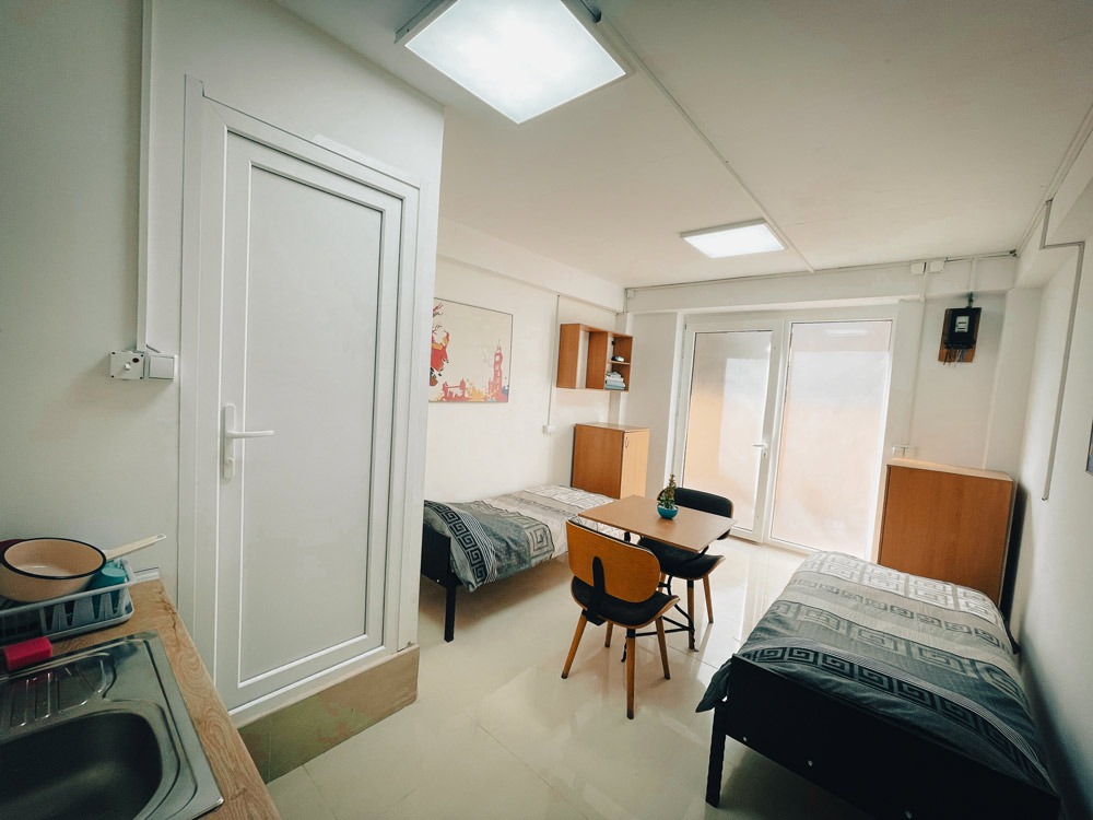 beds, tables, chairs, door, entrance,